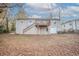 View of the home's backyard and exterior with walkout basement and wooden deck at 3234 Bluebird Ln, Decatur, GA 30032