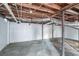 View of the unfinished basement with exposed utilities and concrete floor at 3234 Bluebird Ln, Decatur, GA 30032