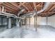 View of the unfinished basement with exposed utilities and concrete floor at 3234 Bluebird Ln, Decatur, GA 30032