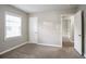 Bedroom with carpet, bright window, and a door to another room at 3234 Bluebird Ln, Decatur, GA 30032