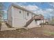 Exterior view of the home with a walkout basement and wooden deck at 3234 Bluebird Ln, Decatur, GA 30032