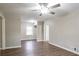 Spacious living room with modern ceiling fan and wood flooring at 3234 Bluebird Ln, Decatur, GA 30032