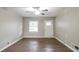 Inviting living room features wood-look flooring, neutral walls and modern ceiling fan at 3234 Bluebird Ln, Decatur, GA 30032