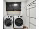 Laundry room with washer, dryer, and cabinets at 727 Coneflower Way, Mcdonough, GA 30253