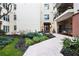 Well-maintained building entrance with landscaping and a courtyard at 175 15Th Ne St # 410, Atlanta, GA 30309