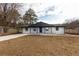 Charming single-story home featuring a painted brick facade, a covered entryway, and a well-maintained front yard at 935 Conley Se Rd, Atlanta, GA 30354