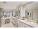 Spa-like bathroom with double vanity and large mirror at 2660 Peachtree Rd # 27E, Atlanta, GA 30305