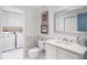 Elegant bathroom with marble flooring and white cabinets at 2660 Peachtree Rd # 27E, Atlanta, GA 30305