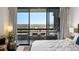 Bedroom with access to balcony, featuring city views and a comfortable bed at 2660 Peachtree Rd # 27E, Atlanta, GA 30305