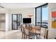 Bright dining area with wood table and city views at 2660 Peachtree Rd # 27E, Atlanta, GA 30305