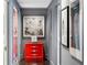 Modern hallway with red dresser and gray walls at 2660 Peachtree Rd # 27E, Atlanta, GA 30305