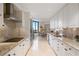 Updated kitchen featuring granite countertops and white cabinetry at 2660 Peachtree Rd # 27E, Atlanta, GA 30305