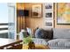 Living area features gray sofa, decorative pillows, and city views at 2660 Peachtree Rd # 27E, Atlanta, GA 30305