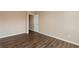 Well-lit bedroom with wood-look flooring and access to a bathroom at 3607 Ginnis Sw Dr # 7, Atlanta, GA 30331