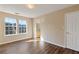 Spacious bedroom with large windows and wood-look flooring at 3607 Ginnis Sw Dr # 7, Atlanta, GA 30331