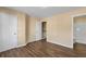 Bedroom with dark laminate flooring and access to a bathroom at 3607 Ginnis Sw Dr # 7, Atlanta, GA 30331