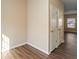 Hallway with hardwood floors and neutral walls at 3607 Ginnis Sw Dr # 7, Atlanta, GA 30331