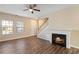 Living room with hardwood floors, fireplace, and staircase at 3607 Ginnis Sw Dr # 7, Atlanta, GA 30331