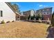 Spacious backyard with artificial turf and mature trees at 501 Olympic Way, Acworth, GA 30102