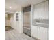 Basement features a stainless steel refrigerator and white cabinets at 521 E Wesley Ne Rd, Atlanta, GA 30305