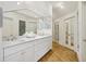 Elegant bathroom with double vanity, marble countertops, and hardwood floors at 521 E Wesley Ne Rd, Atlanta, GA 30305