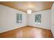 Bright bedroom with hardwood floors and window shutters at 521 E Wesley Ne Rd, Atlanta, GA 30305