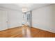 Well-lit bedroom with hardwood floors and access to bathroom at 521 E Wesley Ne Rd, Atlanta, GA 30305