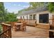 Large deck with wooden furniture, perfect for outdoor dining at 521 E Wesley Ne Rd, Atlanta, GA 30305