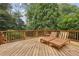 Spacious deck with wooden lounge chairs and a side table at 521 E Wesley Ne Rd, Atlanta, GA 30305