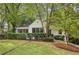 White brick home with manicured lawn and mature trees at 521 E Wesley Ne Rd, Atlanta, GA 30305