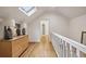 Upper hallway with hardwood floors and white railing at 521 E Wesley Ne Rd, Atlanta, GA 30305