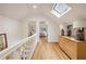 Bright hallway with hardwood floors and skylight at 521 E Wesley Ne Rd, Atlanta, GA 30305