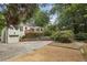 White brick house with a deck and attached garage at 521 E Wesley Ne Rd, Atlanta, GA 30305