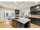 Open kitchen with large island and stainless steel appliances at 521 E Wesley Ne Rd, Atlanta, GA 30305