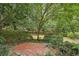 Brick patio nestled in a private, wooded backyard setting at 521 E Wesley Ne Rd, Atlanta, GA 30305