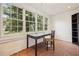 Sunroom with terracotta tile floor, built-in desk and shelving at 521 E Wesley Ne Rd, Atlanta, GA 30305