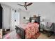 Spacious bedroom with ceiling fan and large bed at 679 N Central Ave, Hapeville, GA 30354