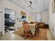 Bright dining room with table, chairs, and view into kitchen at 679 N Central Ave, Hapeville, GA 30354