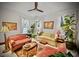 Bright living room with hardwood floors, sofas and a ceiling fan at 679 N Central Ave, Hapeville, GA 30354