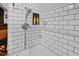 Clean shower stall with subway tile and handheld shower head at 679 N Central Ave, Hapeville, GA 30354