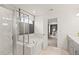 Luxurious bathroom with a marble shower and soaking tub at 106 Delilah St, Mcdonough, GA 30252