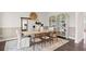 Elegant dining room with a large table and built-in shelving at 106 Delilah St, Mcdonough, GA 30252