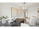 Bright home office features a large desk, comfortable seating, and stylish decor at 106 Delilah St, Mcdonough, GA 30252