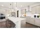 Modern kitchen with stainless steel appliances and white quartz countertops at 106 Delilah St, Mcdonough, GA 30252