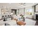 Open floor plan with a large kitchen island and adjacent living area at 106 Delilah St, Mcdonough, GA 30252