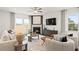 Spacious living room featuring a fireplace and ample natural light at 106 Delilah St, Mcdonough, GA 30252