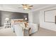 Relaxing main bedroom with a cozy sitting area and neutral color palette at 106 Delilah St, Mcdonough, GA 30252
