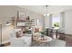 Bright office with two armchairs, a coffee table, and built-in shelving at 106 Delilah St, Mcdonough, GA 30252