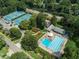 Aerial view showing pool, tennis courts at 1185 Weldstone Ct, Atlanta, GA 30350