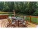 Spacious deck with dining area, hot tub and wooded views at 1185 Weldstone Ct, Atlanta, GA 30350